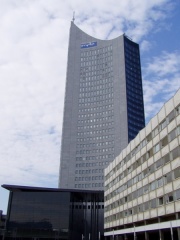 Former main building (Skyscraper and white building).